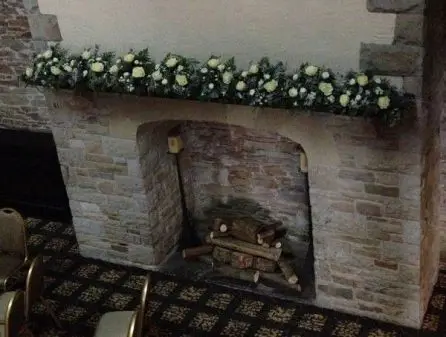 Winter Wedding Eryngium And White flowers Mantle piece arrangement