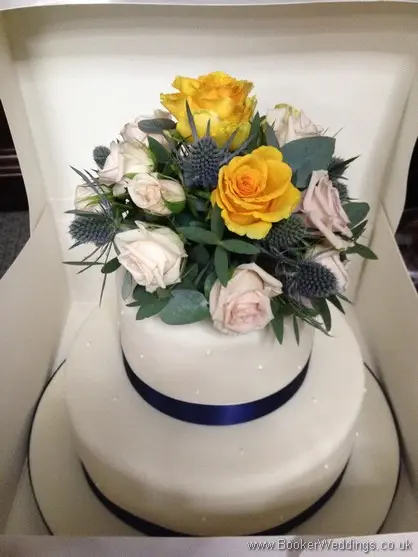 Gold, Peach and Navy Wedding Cake Decoration with Roses and Eryngium