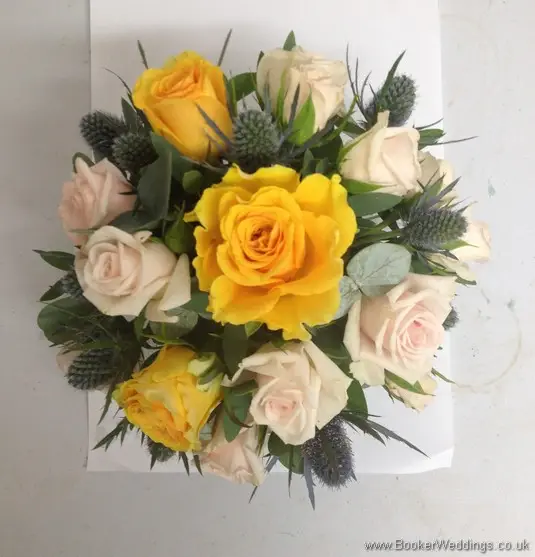 Gold, peach and Navy Cake Flower Decoration with Roses, Spray roses, Eryngium, Brunia Berries and Eucalyptus Top View