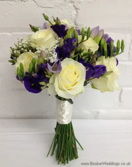Purple and cream wedding flower Bridal Bouquet with ivory avalanche roses, purple lissianthus, lilac freesia and gypsophila Side View