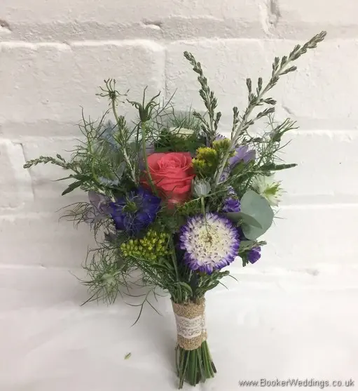 Bright and Wild Bridesmaid Bouquet with Aster, Silver Foliage’s, Nigella, Coral Roses, White spray roses, Solidaster, Purple Freesia, Pink Phlox Side View