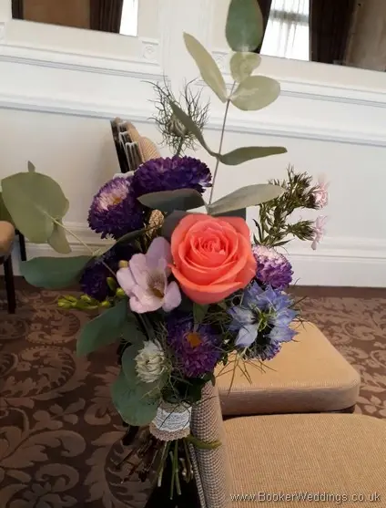 Bright and wild pew ends with Aster, Silver Foliage’s, Nigella, Coral Roses, White spray roses, Solidaster, Purple Freesia, Pink Phlox