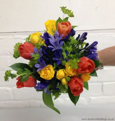 Brightly Coloured Bridesmaid Bouquet in Primary Colours with Tulips, Agapanthus and Spray Roses