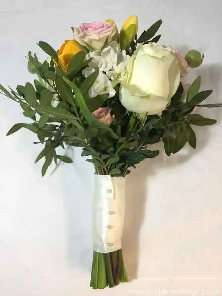 Bridesmaid Bouquet with freesia, roses, ranunculus narcisis and spray roses