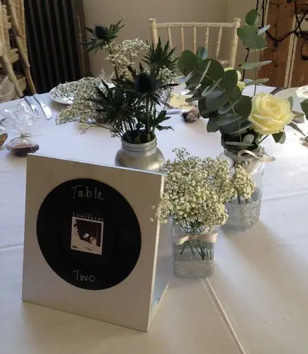 Jar Table Arangments Rose Eryngium and Gypsophilia 1