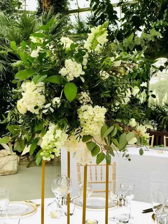 White Flower Pedestal with Flowing Foliage