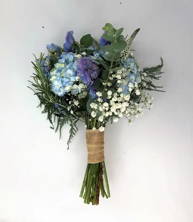 Pretty Summer Bridesmaids Handtied with Blue Flowers