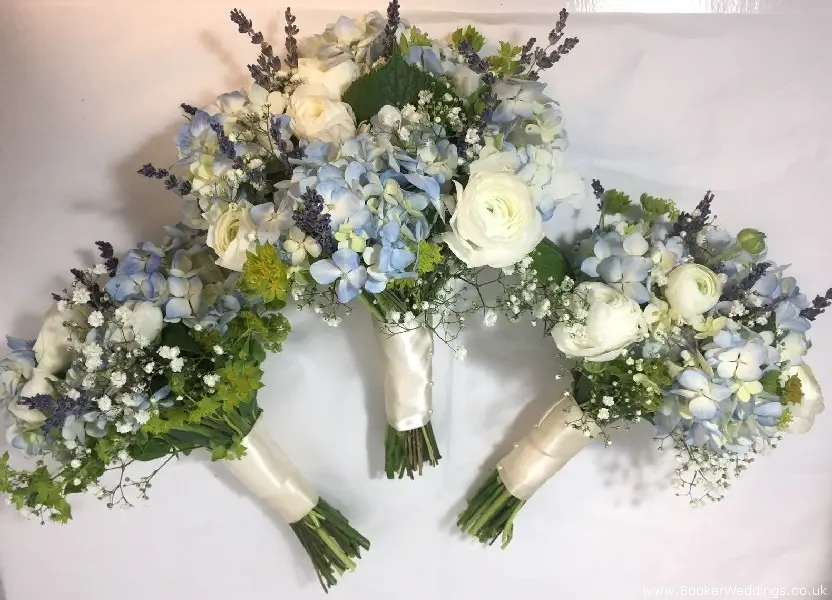 Bride and bridesmaid hand-tied bouquets in blue and white