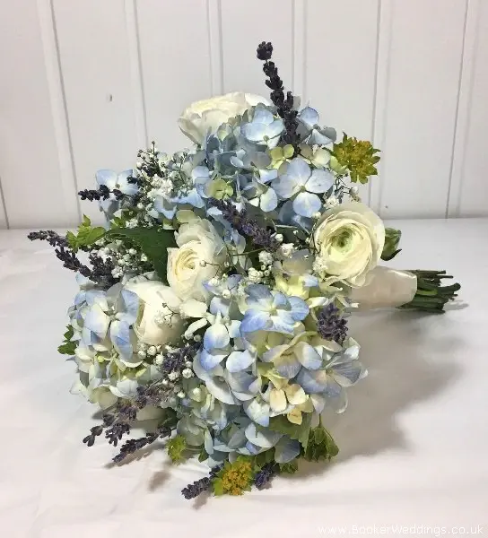 Bride hand-tied bouquet using blue Hydrangea and white Ranunculus