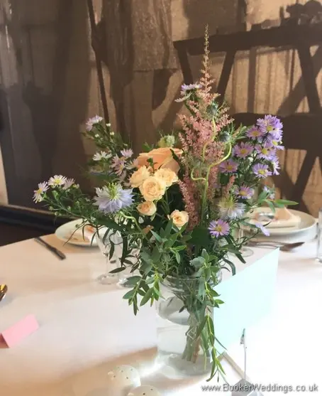 Wild Just Picked Garden Flowers in peach, pink, purple and blue in Kilner Jars for Table Centrepieces at Bluecoat Liverpool City Centre