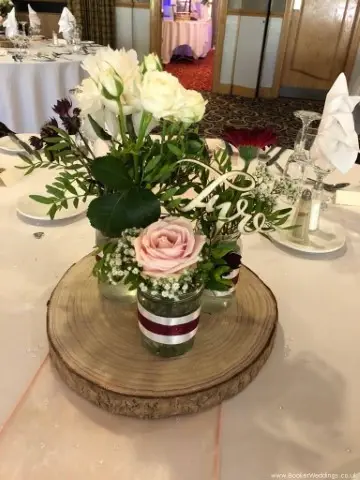 Rustic Table Centrepiece  Flowers in Glass Jars and Log