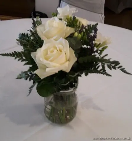 Lavender and Cream Jars of Flowers for Reception Table Arrangements with Roses, Freesias and Lavender at Sefton Park Hotel
