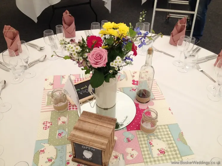 Jug Table Centrepieces filled with Just Picked Multicoloured Meadow Flowers at Speke Hall, Liverpool
