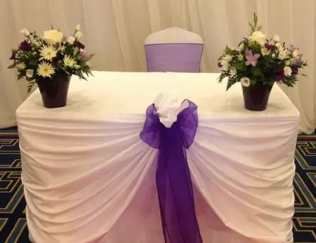 Purple and White Top Table Arrangements