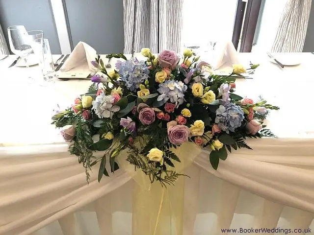 Top Table Arrangement of Roses Spray Roses Hydrangea Freesia