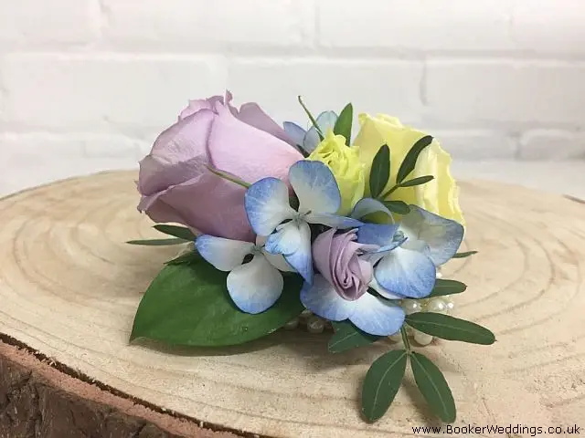 Wrist Corsage of Lilac Rose White Lisianthus and Hydrangea