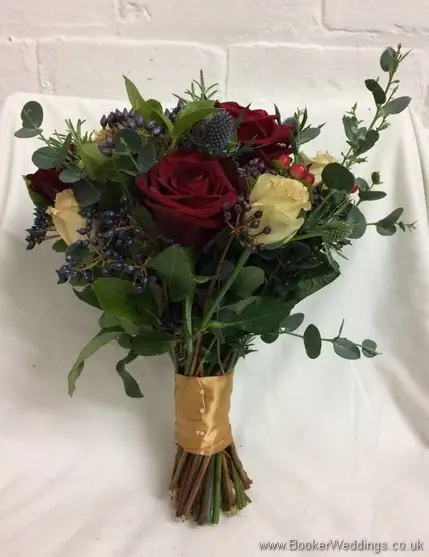 Just picked winter wedding bridal bouquet of red and sandy roses, eryngium, viburnum berries, hypericum berries, rosemary and eucalyptus