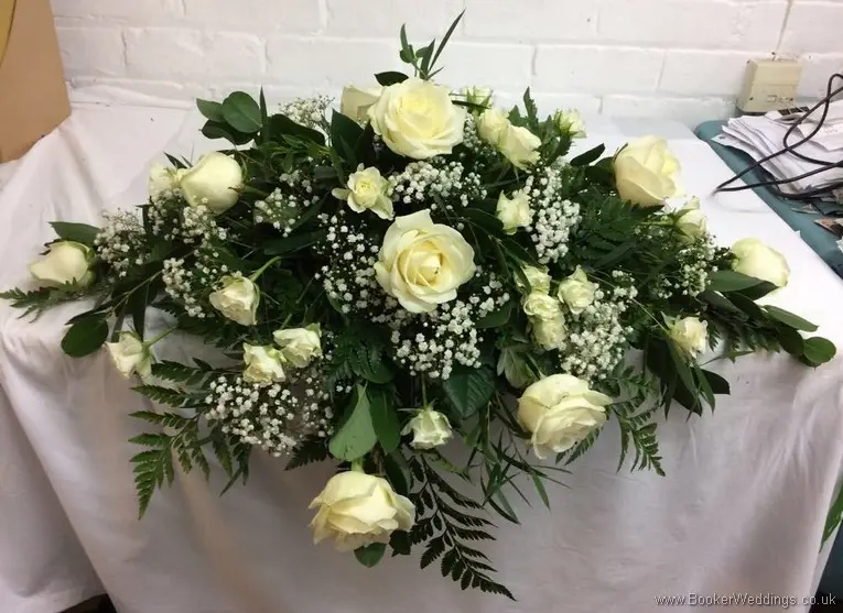 Cream rose and gypsy grass top table arrangement