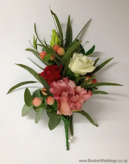 Wild Flowers with lots of texture and foliage in cream, coral and burgundy with roses, hypericum berries, lissianthus and eucalyptus Pin Corsage