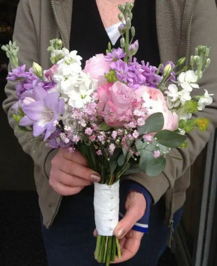 Rose Poeny Stock Pink Purple and Lilac Country Style Brides Bouquet Side
