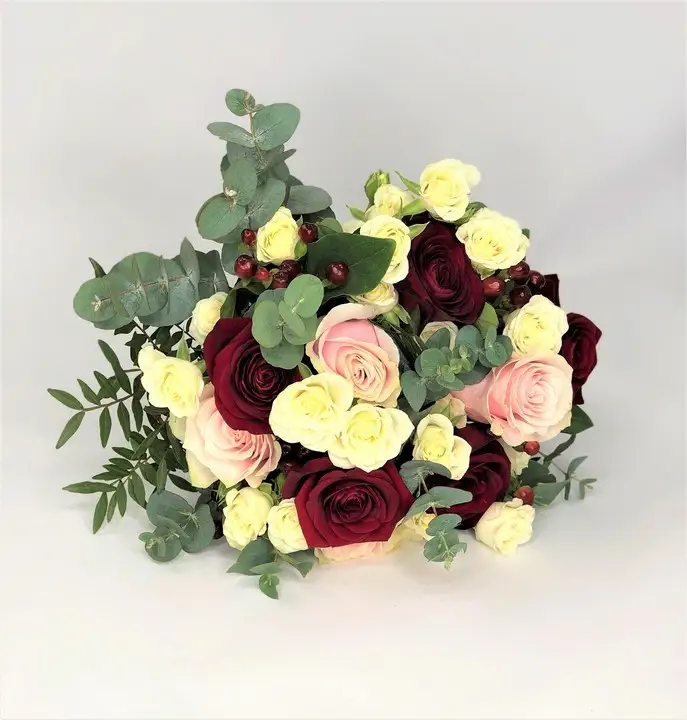 Compact Bridal Bouquet with Lots of Mixed Roses and Eucalyptus