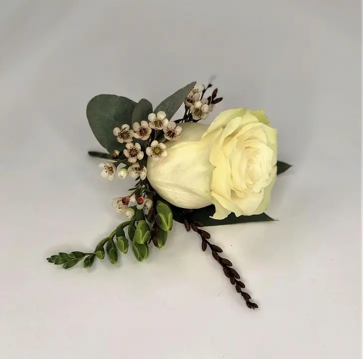 White Rose Buttonhole with Freesia and Waxflower