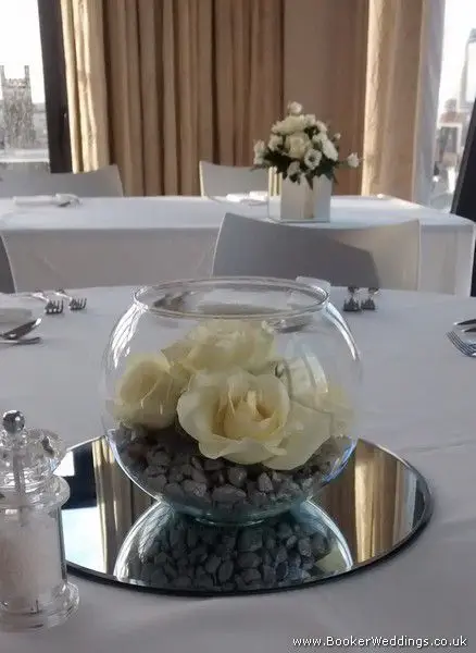 All white rose mirror fishbowl table arrangement at Hope Street Hotel