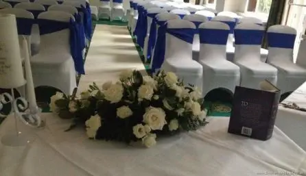 All White Rose and Orchid  Registrars Table Arrangement Back View at The Atlantic Hotel