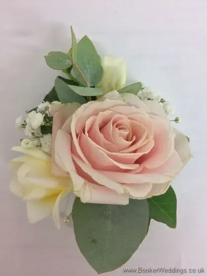Soft pink and white Grooms buttonhole with rose, freesia and gypsophila