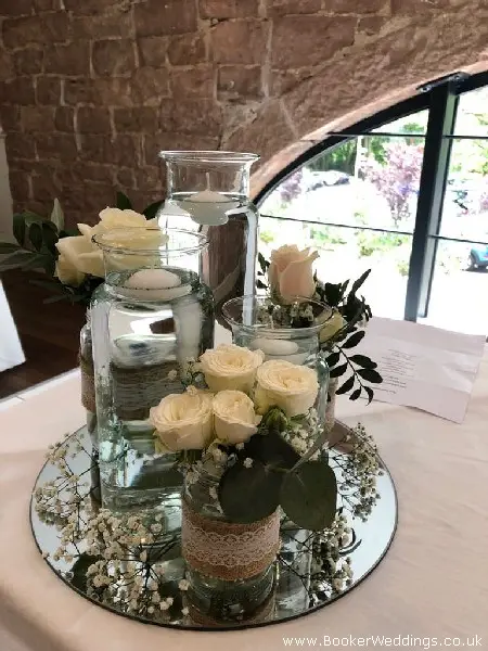Registrar Table Flowers and Mirror Plates for Wedding Ceremony