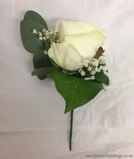 White rose, gypsophila and eucalyptus grooms buttonhole side view
