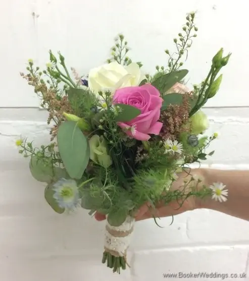 Just picked bridesmaid bouquet with roses, aster daisy, nigella, spray roses, astilbe, lissianthus and eucalyptus side view