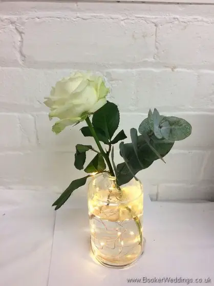 White Rose and Eucalyptus lit up bottle table decoration for reception