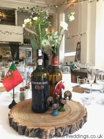 Flowers in Bottles and Log Slices for Rustic Wedding