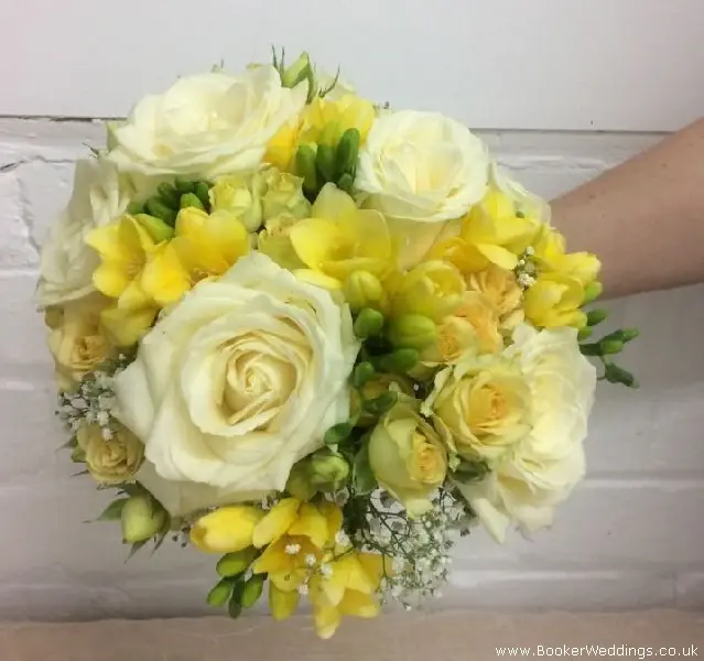 Bride Handtied bouquet of roses, freesia, spray roses and gypsy grass