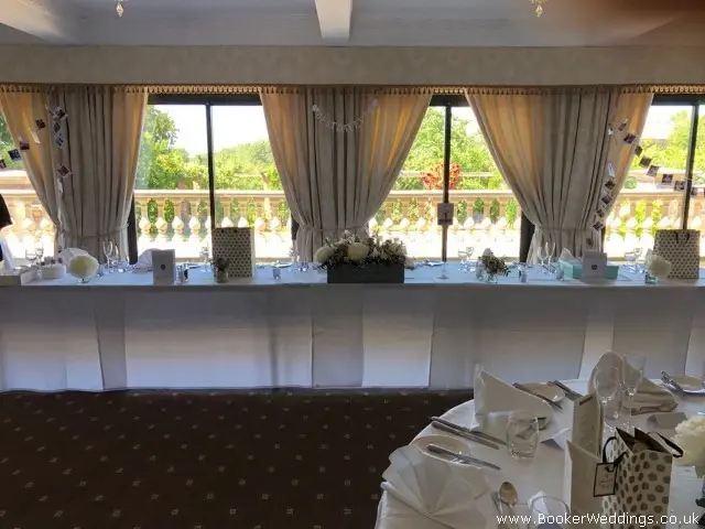 Top Table Arrangement in Personalised Wedding Crate Filled With Lilac and White Flowers