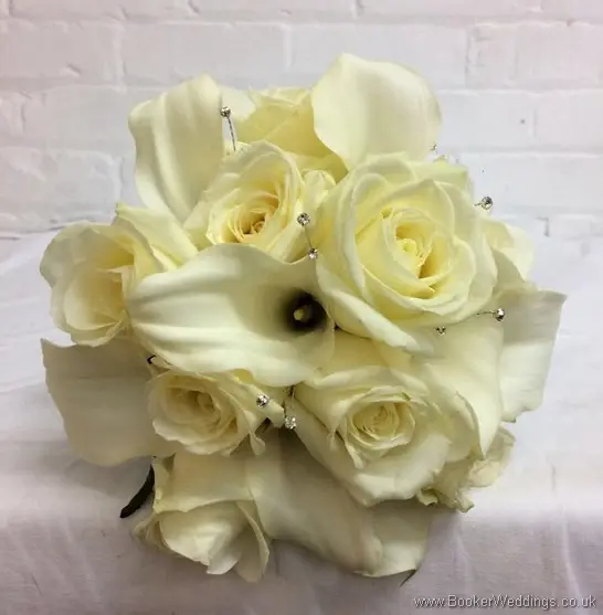 Hand tied ivory roses and calla lilies bridal bouquet with diamantes and royal blue ruffle ribbon_top