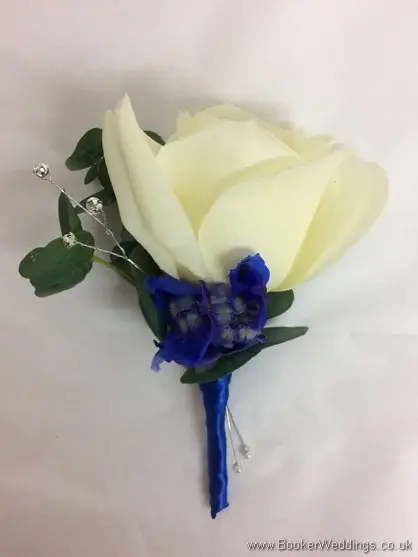 Mothers fancy buttonhole of ivory rose and blue flowers with diamante jewels
