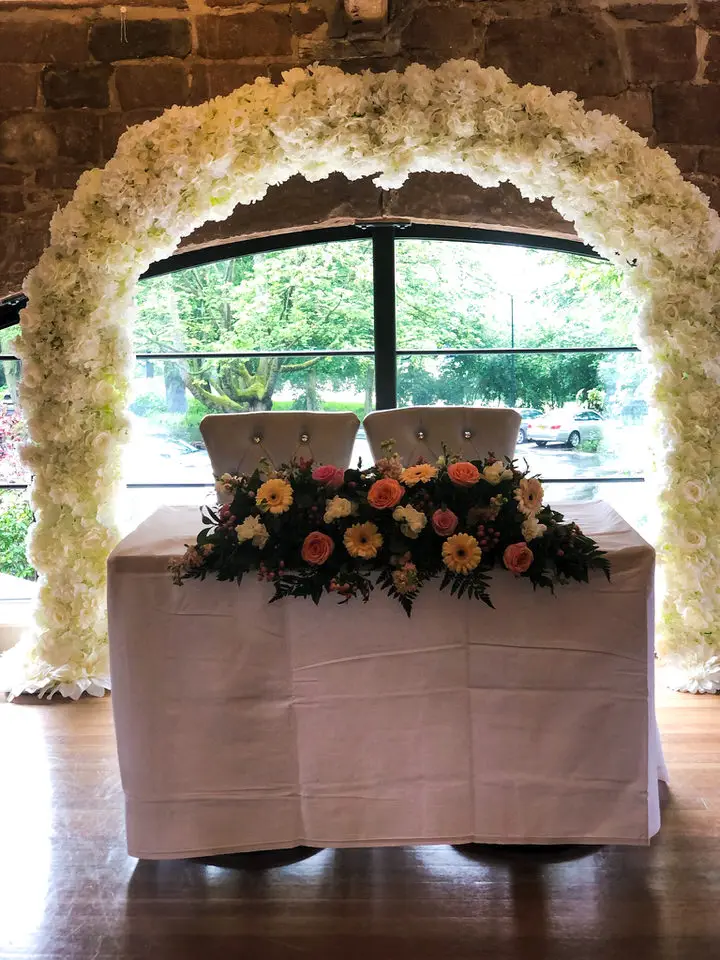 Registrar Table Arrangement in Pink Peach and Coral