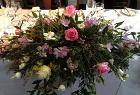 Pink and Lilacs Long and Low Top Table Arrangement Close up