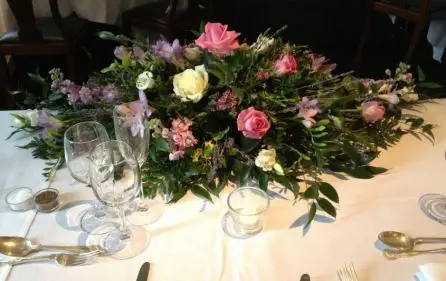 Pink and Lilacs Long and Low Top Table Arrangement Rear