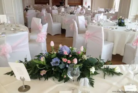 Low and Long Top Table Arrangement with Hydrangea, Tulips, Roses, Freesia, Muscari and Hyacinth Back View at West Tower Aughton
