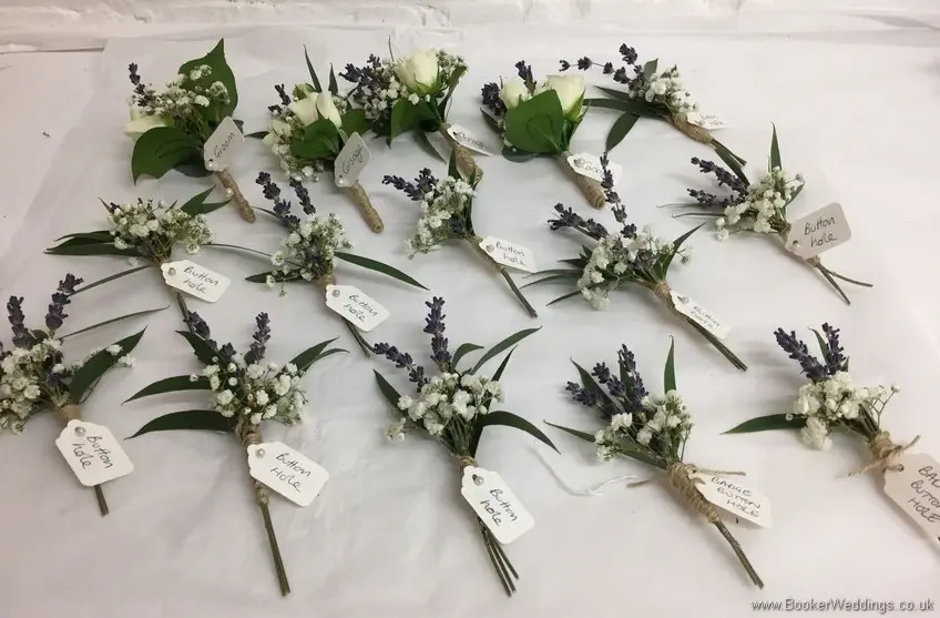 Lavender and White semi-wild buttonholes and pin corsages with name tags