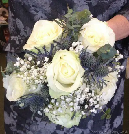 Hand Tied Bridesmaid Bouquet with Cream and White Roses, Blue Eryngium Thistles and Gypsophila