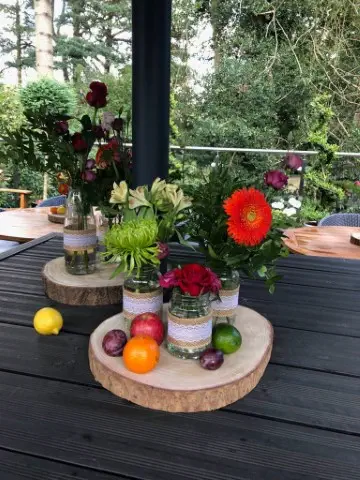 Bright And Vibrant Jam Jar Table Decorations With Gerbera Blooms Alstro