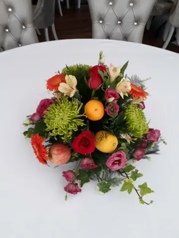 Bright and Vibrant Table Centrepiece  Using Fruit And Flowers