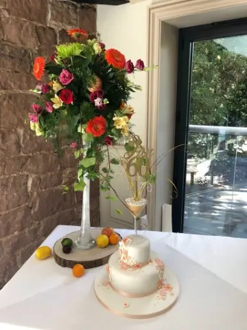 Cake Table Tall Flower Arrangement With Flowers And Fruit