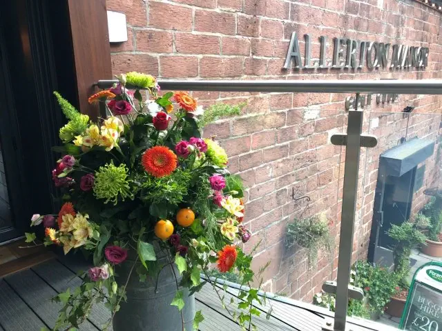 Vibrant Milk Churn At Entrance To The Hay Loft Allerton