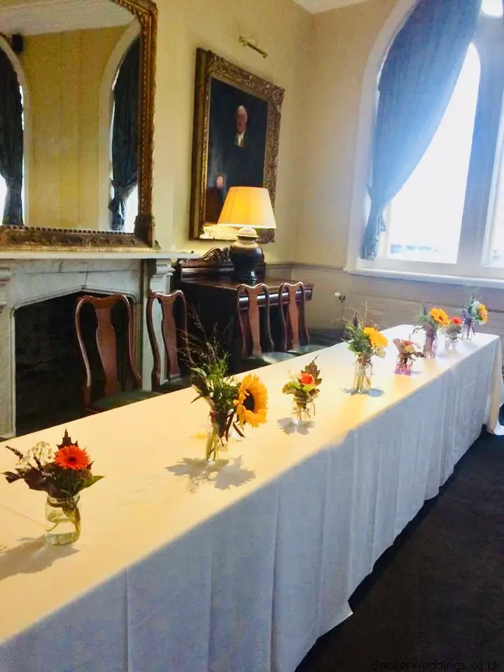 Top Table Flowers in Jars at Racquet Club