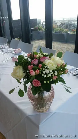 Semi-wild pale pink and cream with roses, ranunculus, bouvardia, spray roses and eucalyptus Top Table Decoration at Hope Street Hotel, Liverpool